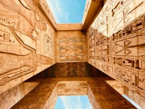 low angle photography of brown concrete building under blue sky during daytime